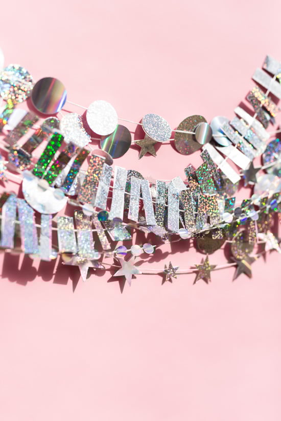 14 New Year's Eve DIYs to Try Before 2016 // DIY Holographic Garland and Photo Booth Backdrop