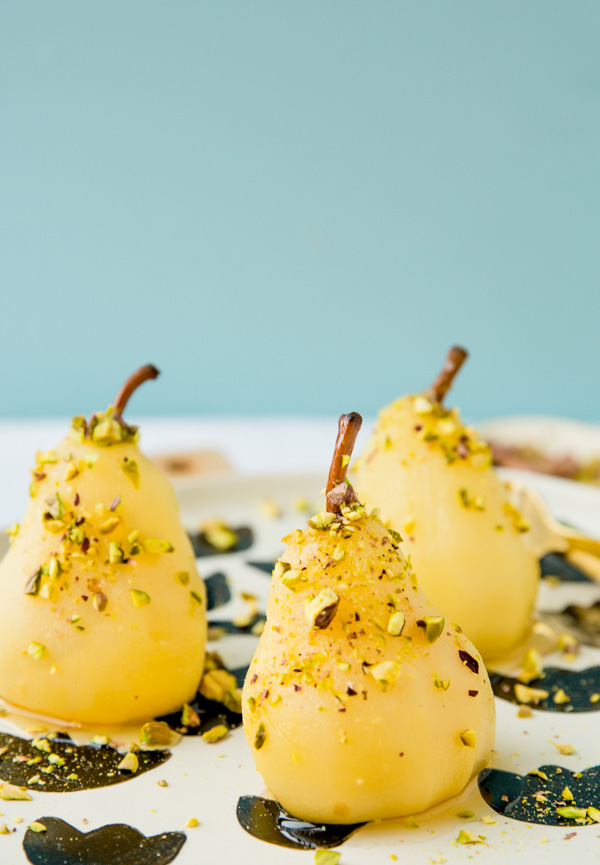 Boozy poached pears with drizzled honey and pistachios