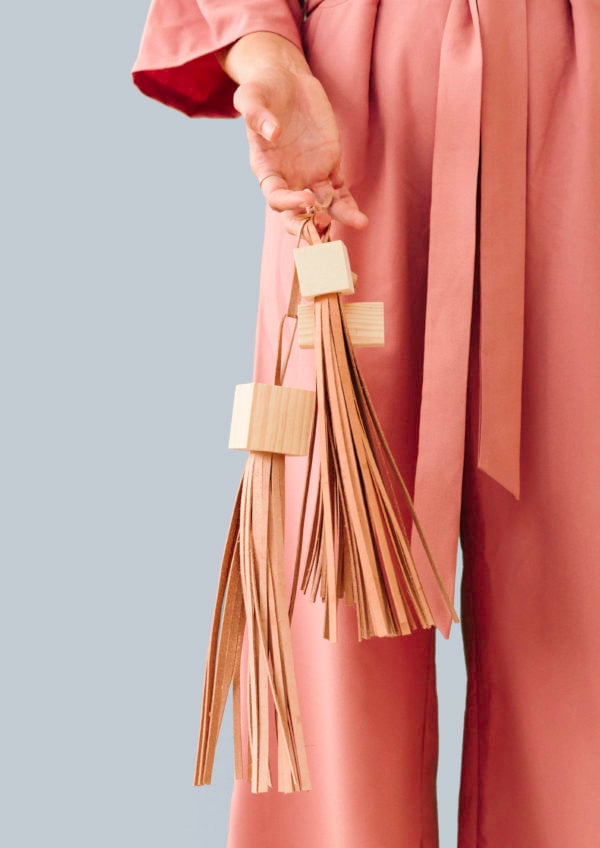 Block Head: DIY Statement Tassels Made with Wood Blocks and Leather. Click through for the tutorial.