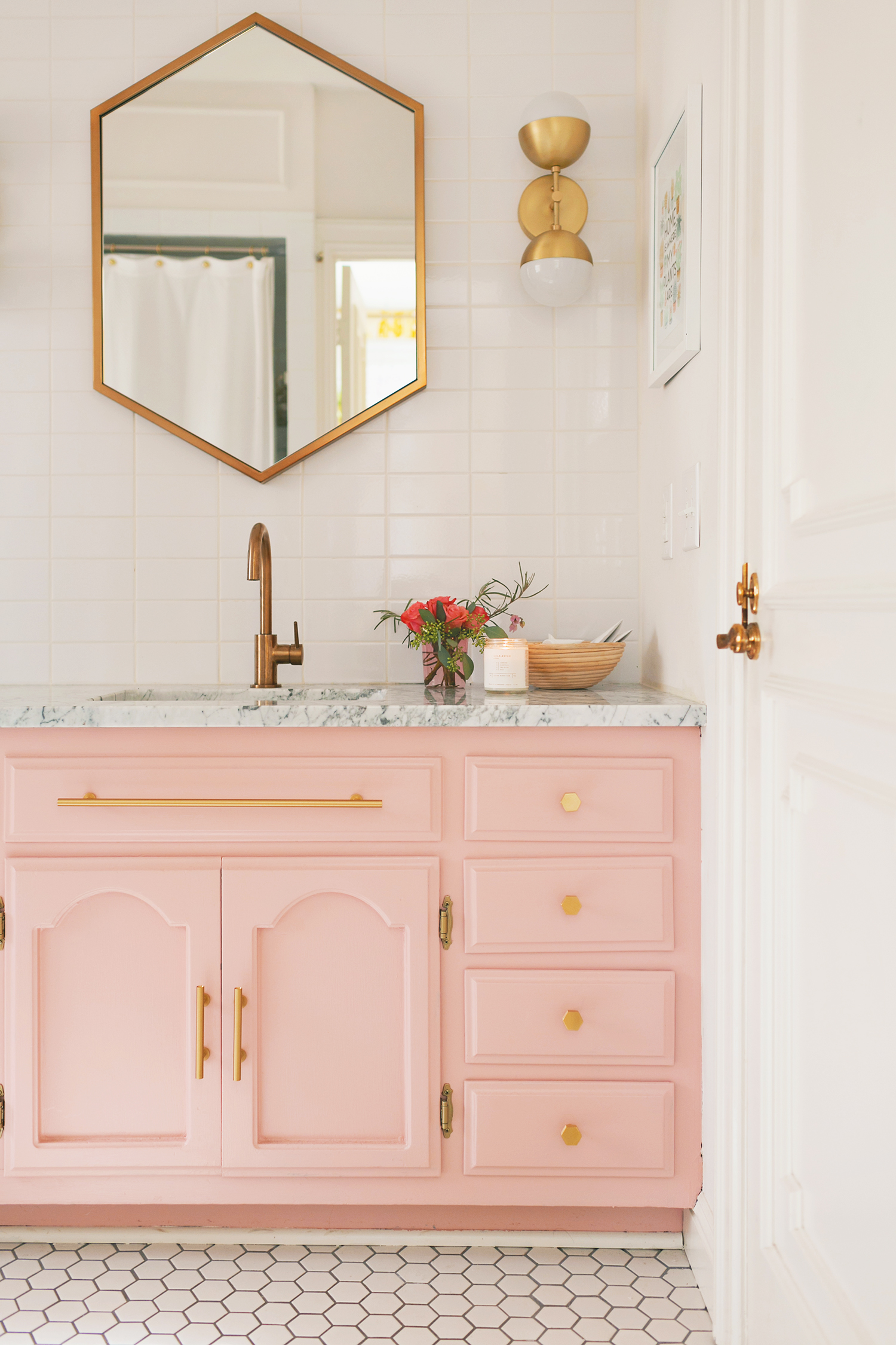 For an affordable bathroom upgrade, consider painting your vanity a fun, fresh color. Want to find out other ways to makeover your bathroom? Check out 13 Easy Ways to Freshen Up Your Bathroom. #paint #bathroom #interiors #tips #makeover #affordable #bathroomupgrade #pink #vanity
