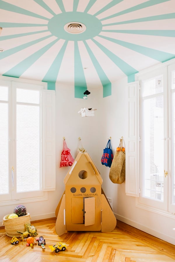 What do you think of the painted ceiling trend? This circus-inspired paint job is super cute for a little kids room. #paintedceiling #kidsroom #coollkidsroon #interiors