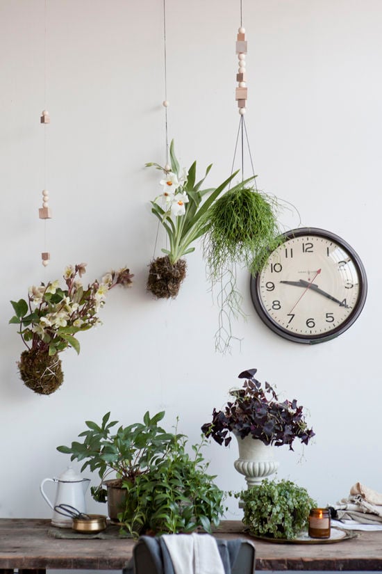 Japanese string garden hanging planters over a rustic wood desk and office space.