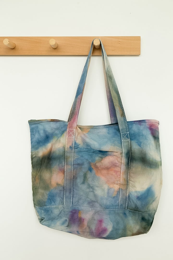 ice dyed tote bag hanging from wood hook