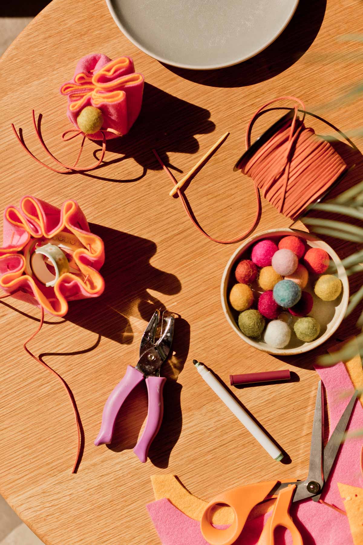 colorful felt drawstring pouches being made