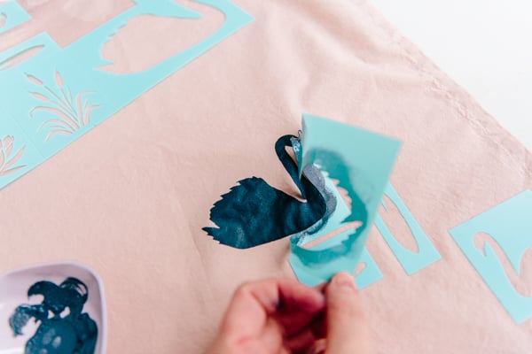 How to make DIY fabric gift wrap for the holidays with stencils. #diyholiday #diy #diygiftwrap #giftwrap #stencils