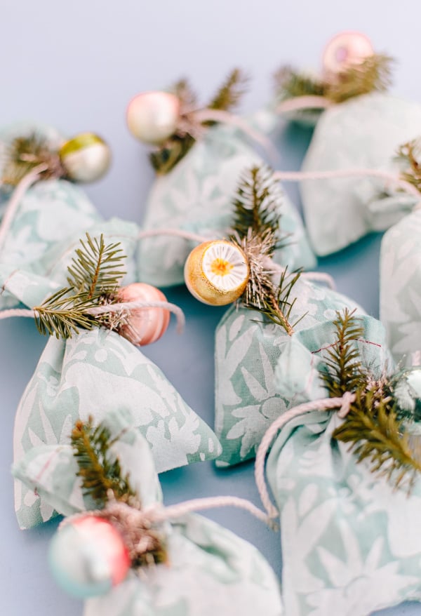 Looking for a unique DIY gift wrap idea for the holidays? Check out this tutorial for DIY fabric gift wrap you can customize for everyone on your gift list. #holidays #giftwrap #diyholidays #diy #stenciling #christmas #christmasdiy
