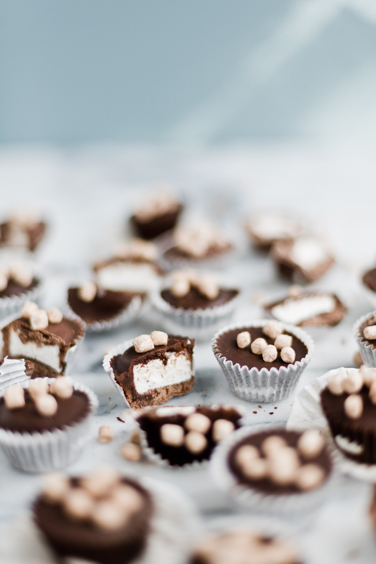 cut up homemade candy cups with marshmallow in the inside