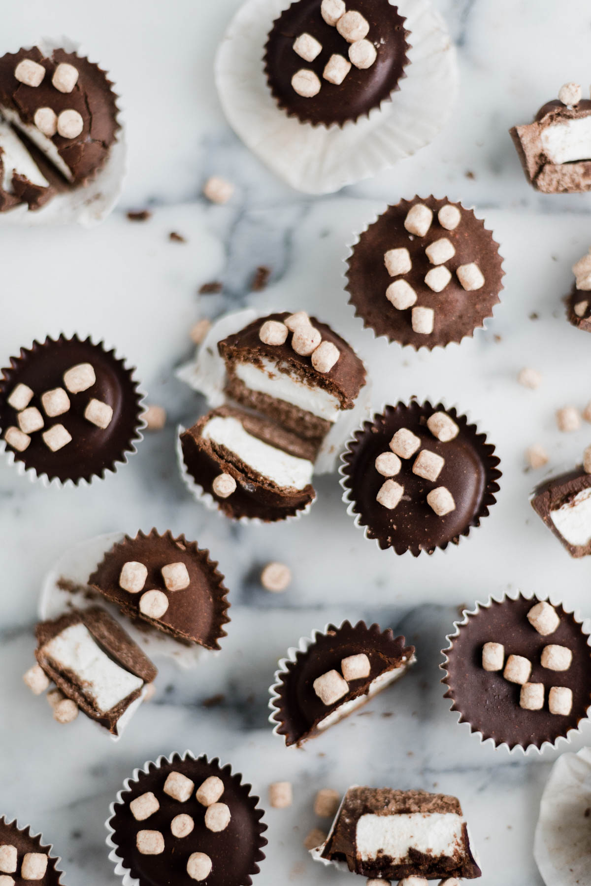 closeup of hot cocoa candy cups on a marble countertop