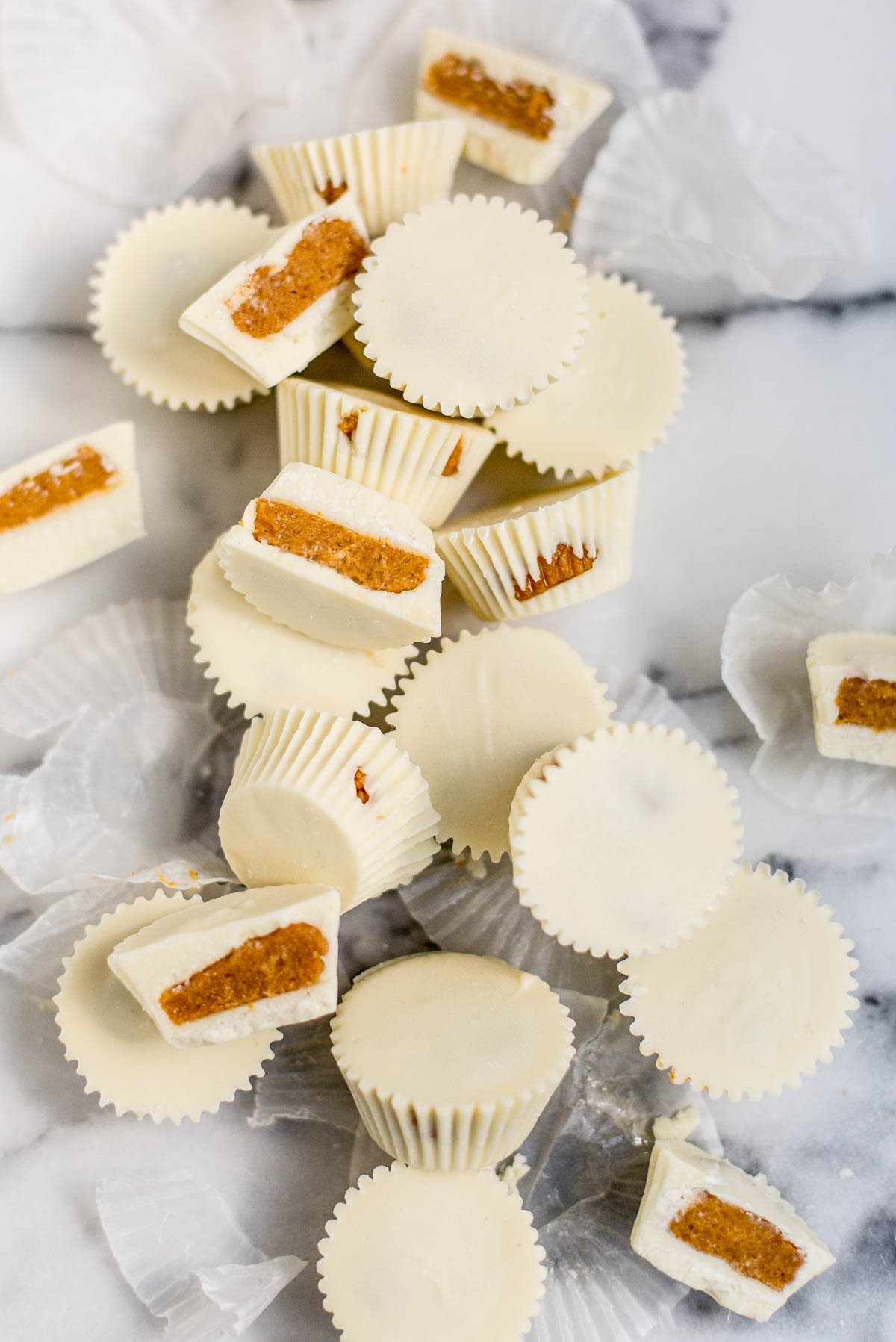 white chocolate candy cups with pumpkin pie filling inside