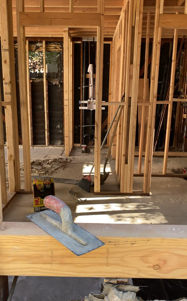 ADU while under construction - showing framing and concrete floor.