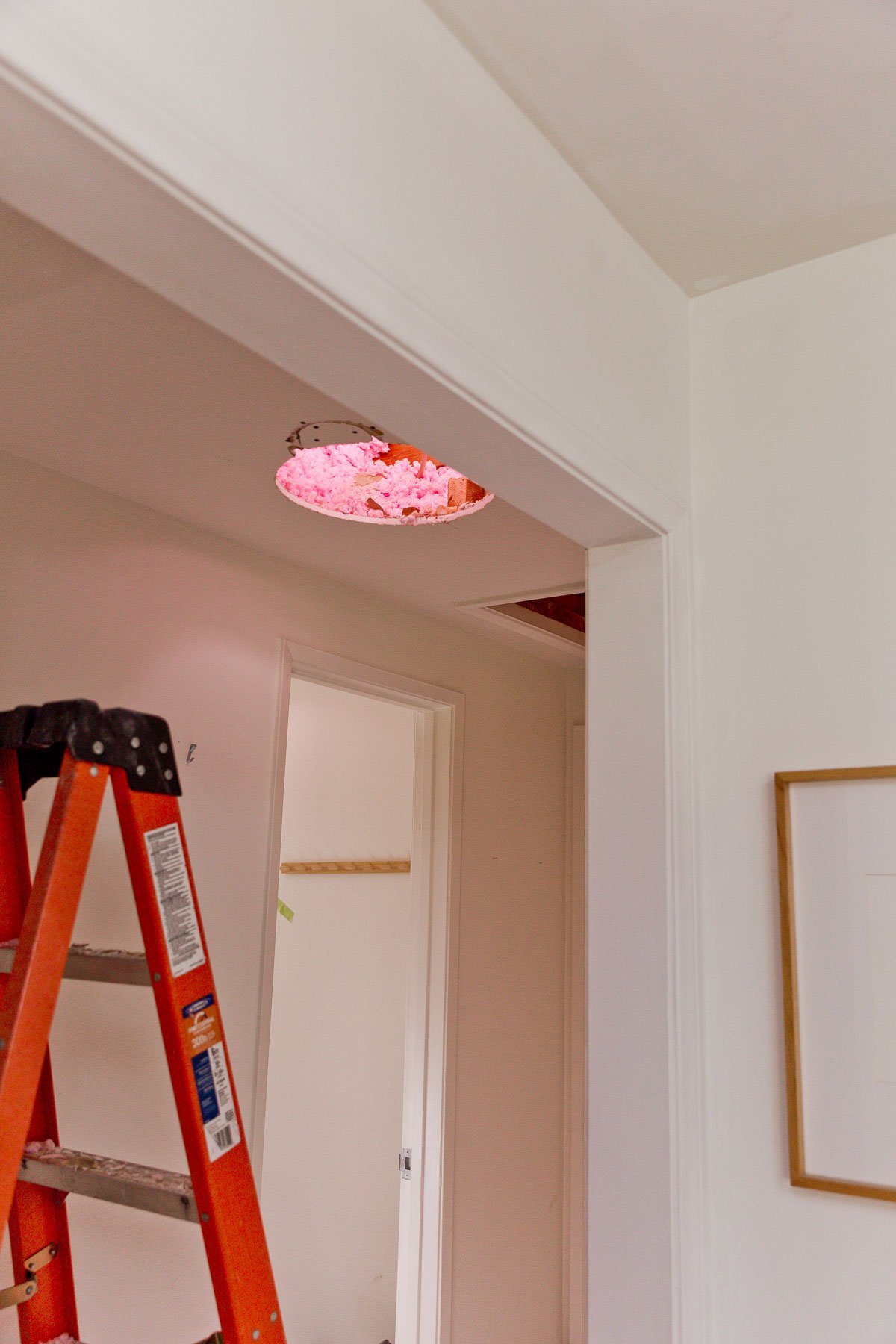 Sun Tunnel installation in small hallway with white walls