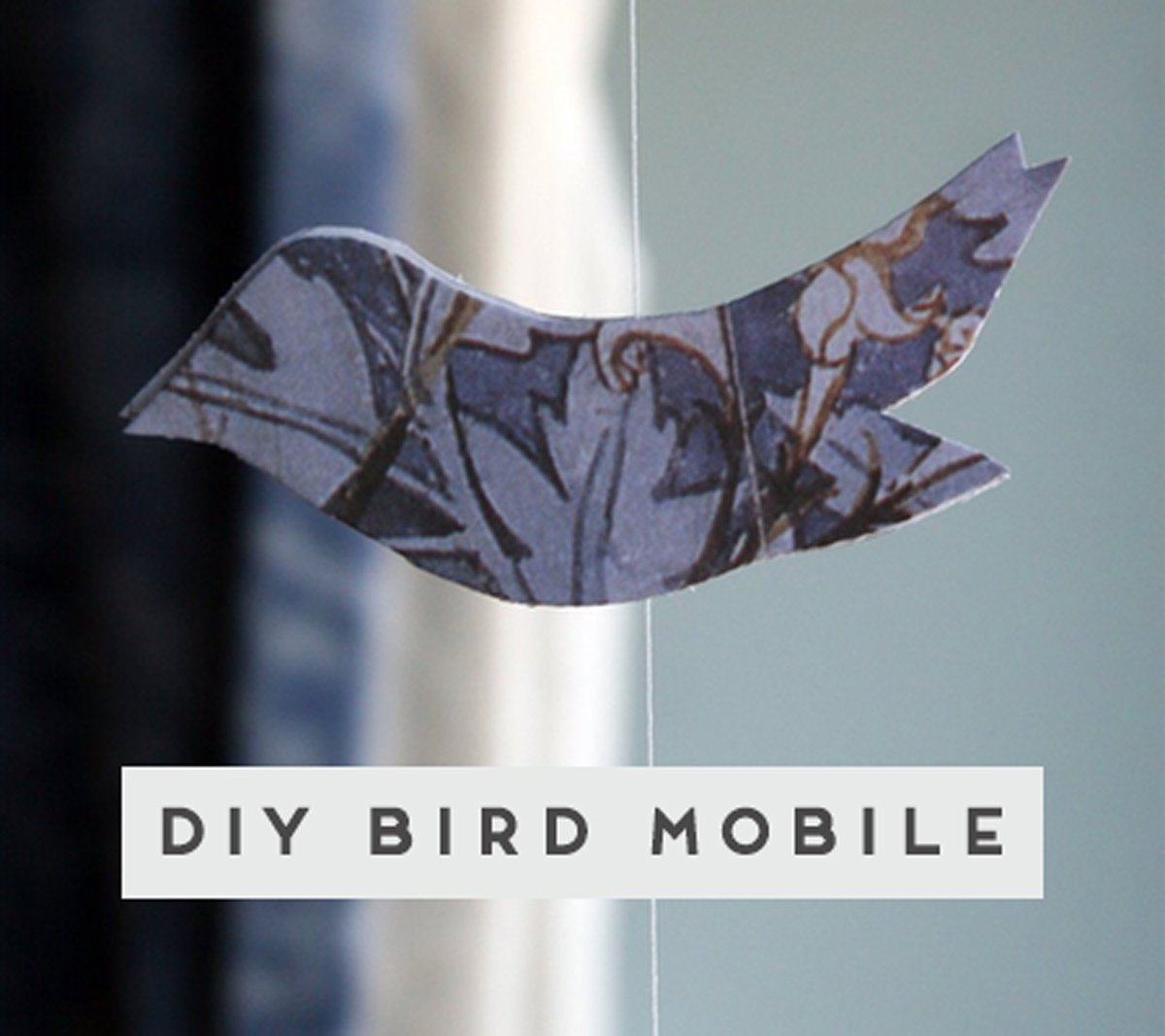 Blue bird mobile made of scrap paper and string