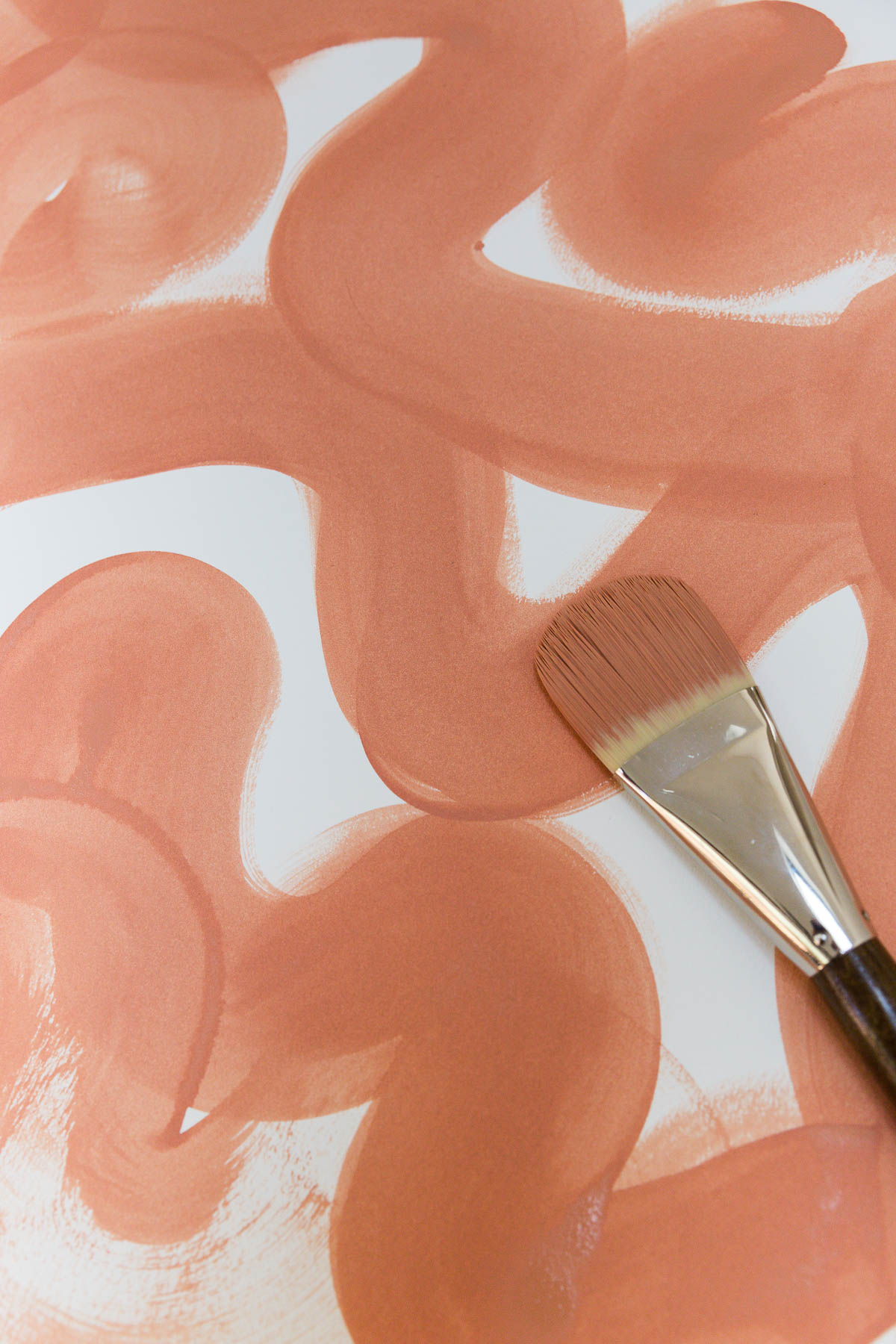 painting squiggly lines with large paint brush