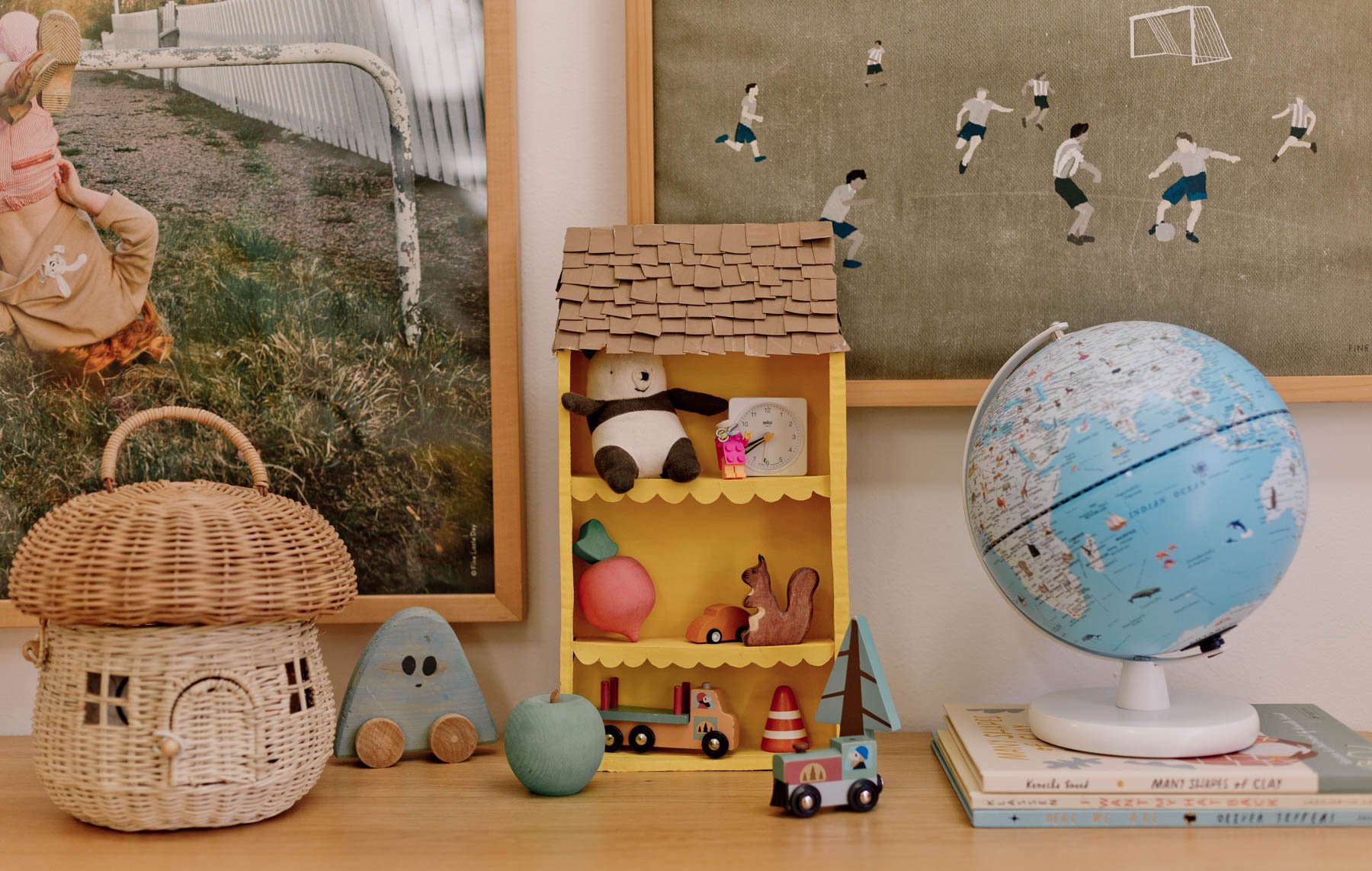 kids room with cool artwork and unique decor on a wood dresser