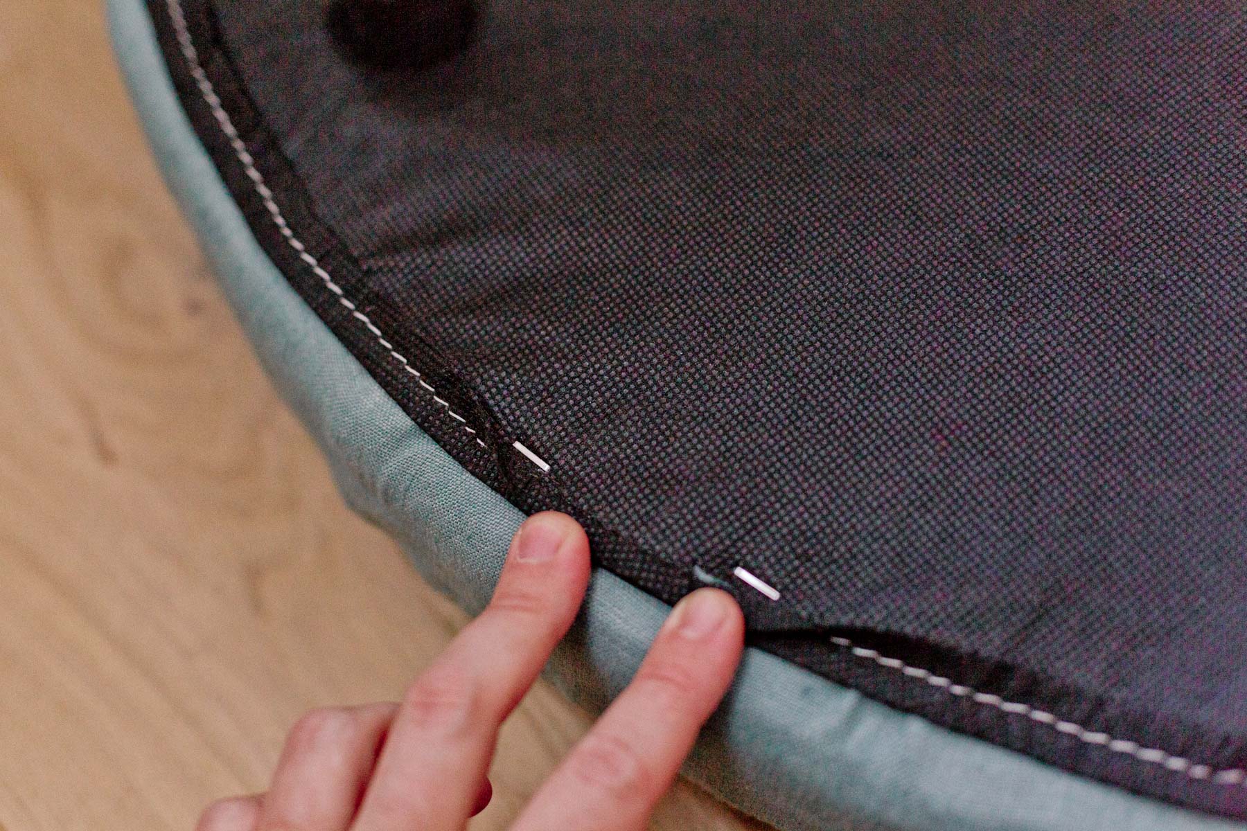 underside of the round ottoman lid
