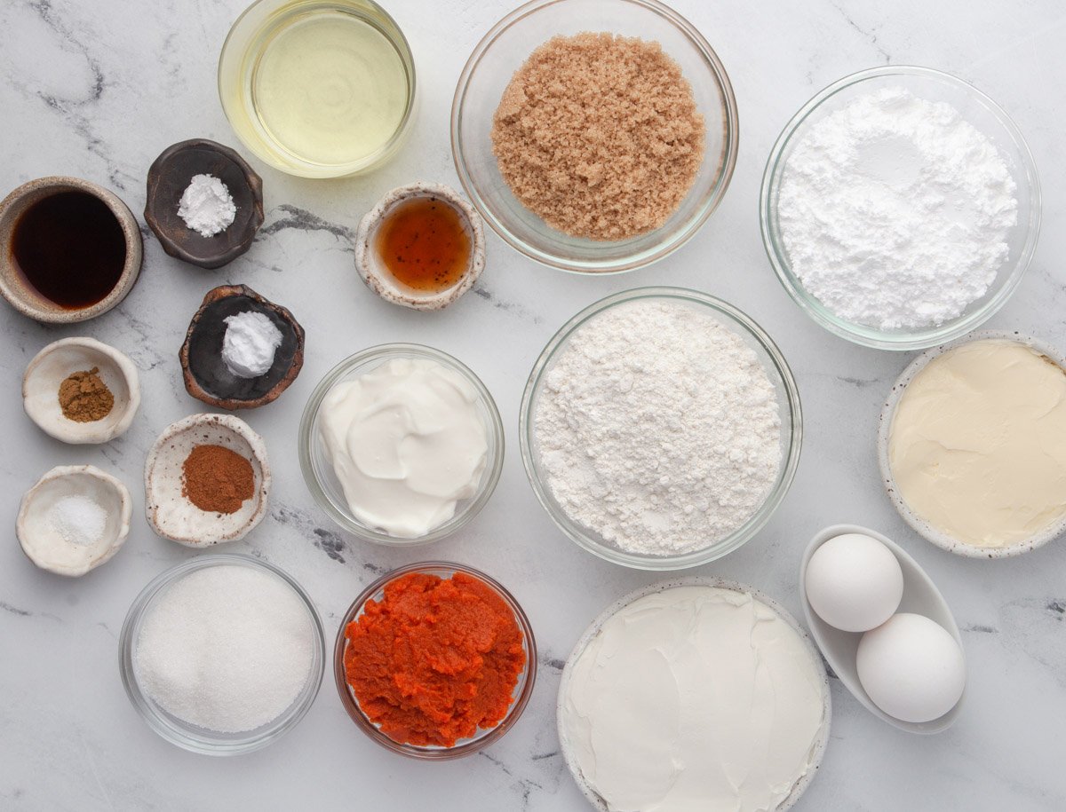 ingredients for pumpkin cupcakes with cream cheese frosting