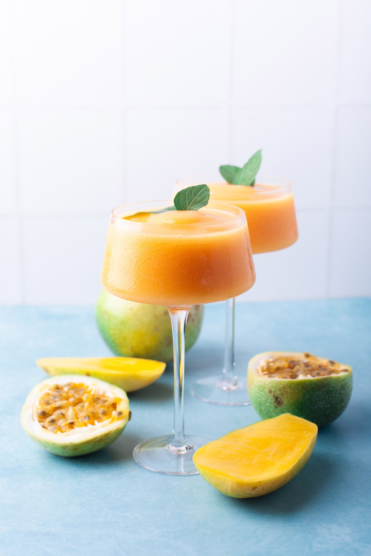 orange frozen cocktails with mint sprigs 