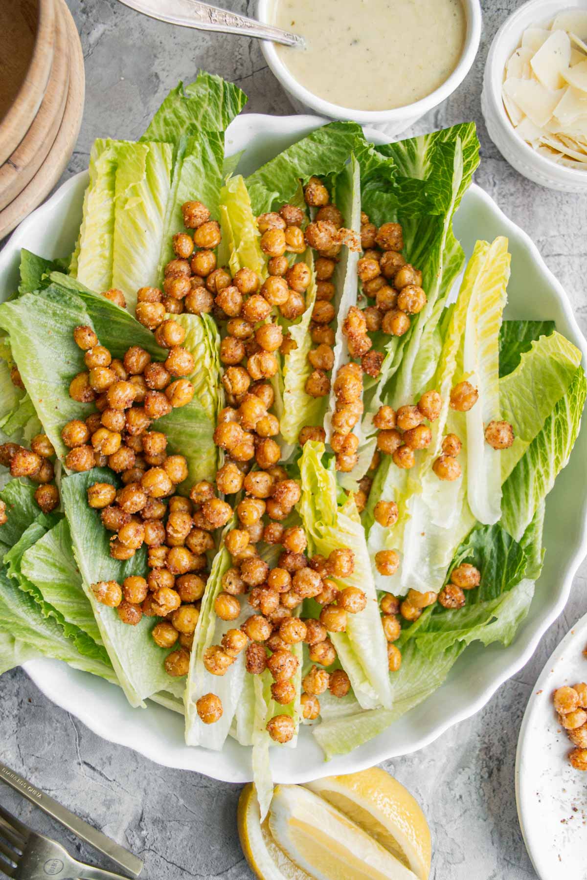 roasted chickpeas on top of a bed of romaine lettuce
