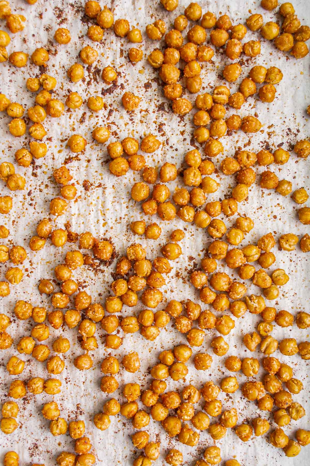 crispy roasted chickpeas on a white baking sheet
