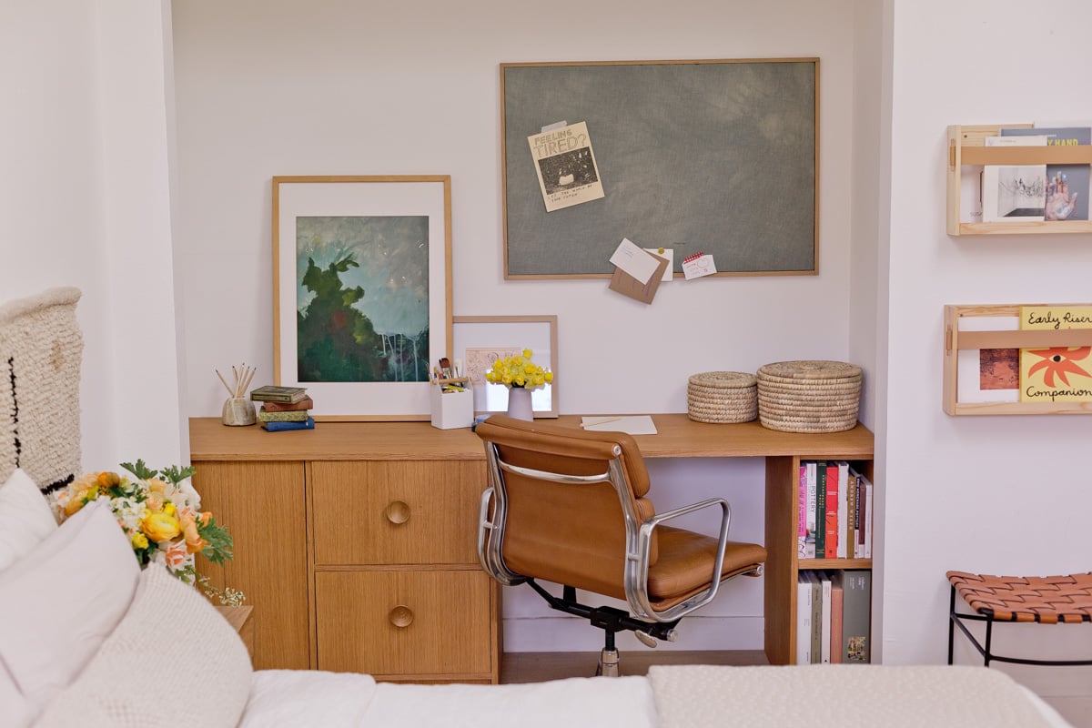 warm wood desk inside a guest bedroom closet - small space home office