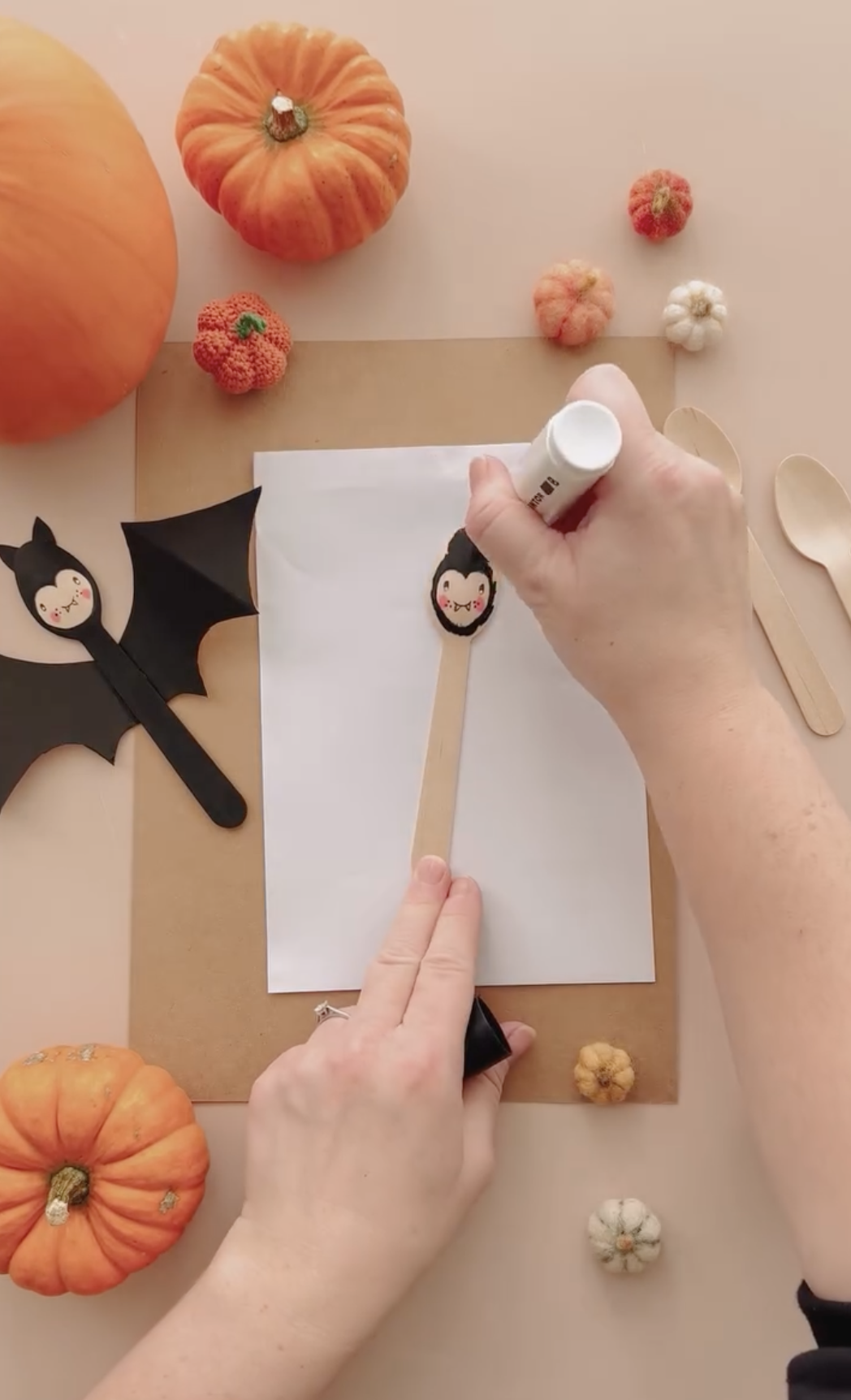 making a craft with a wooden spoon to paint it as a cute black bat for halloween
