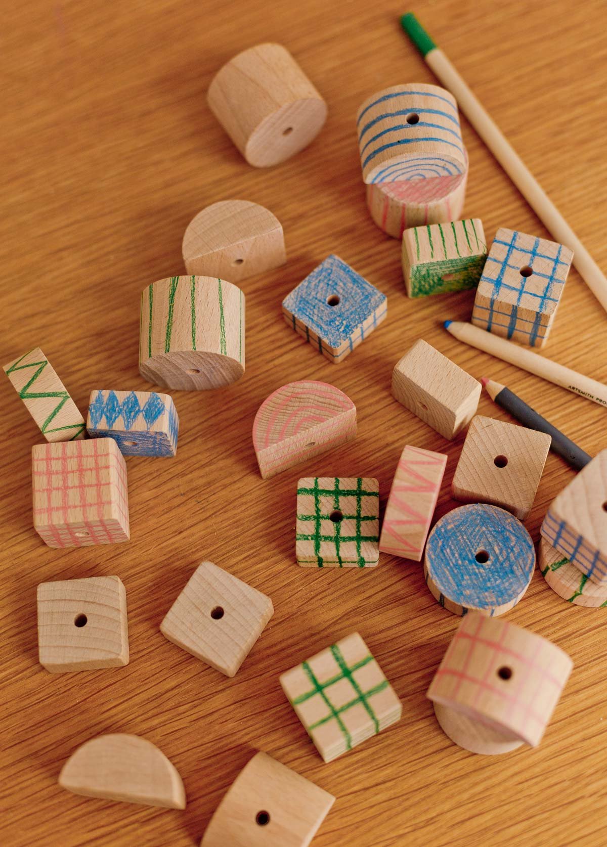 drawing patterns on chunky wood blocks with colored pencils