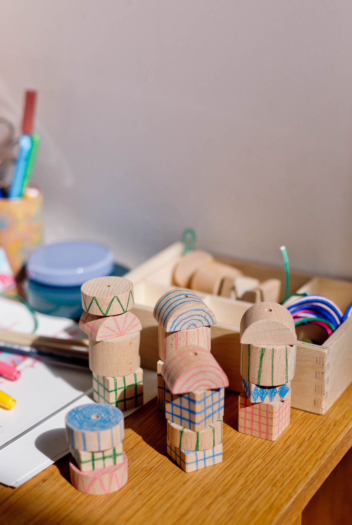 stacked wood blocks with hand drawn patterns on them