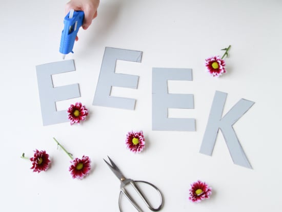 making a flower halloween decoration with burgundy mums and cardboard
