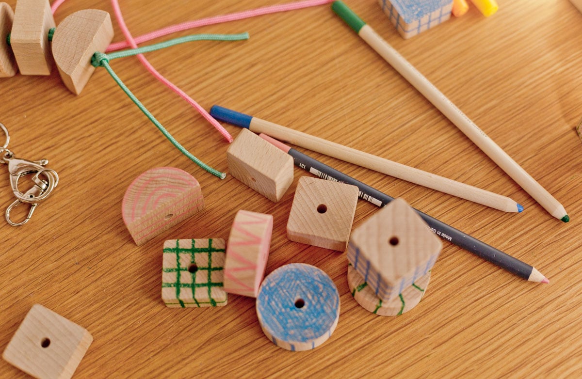chunky wood blocks with patterns drawn onto them with colored pencils