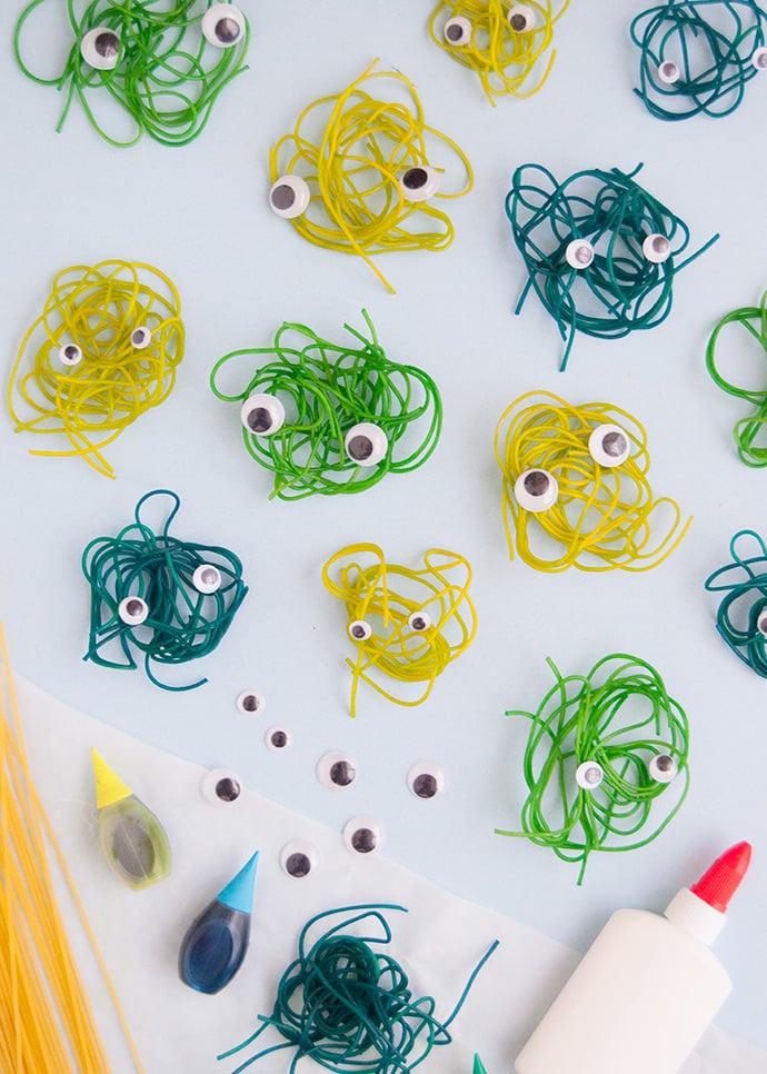 string little craft with googly eyes on it to look like mini monsters for halloween