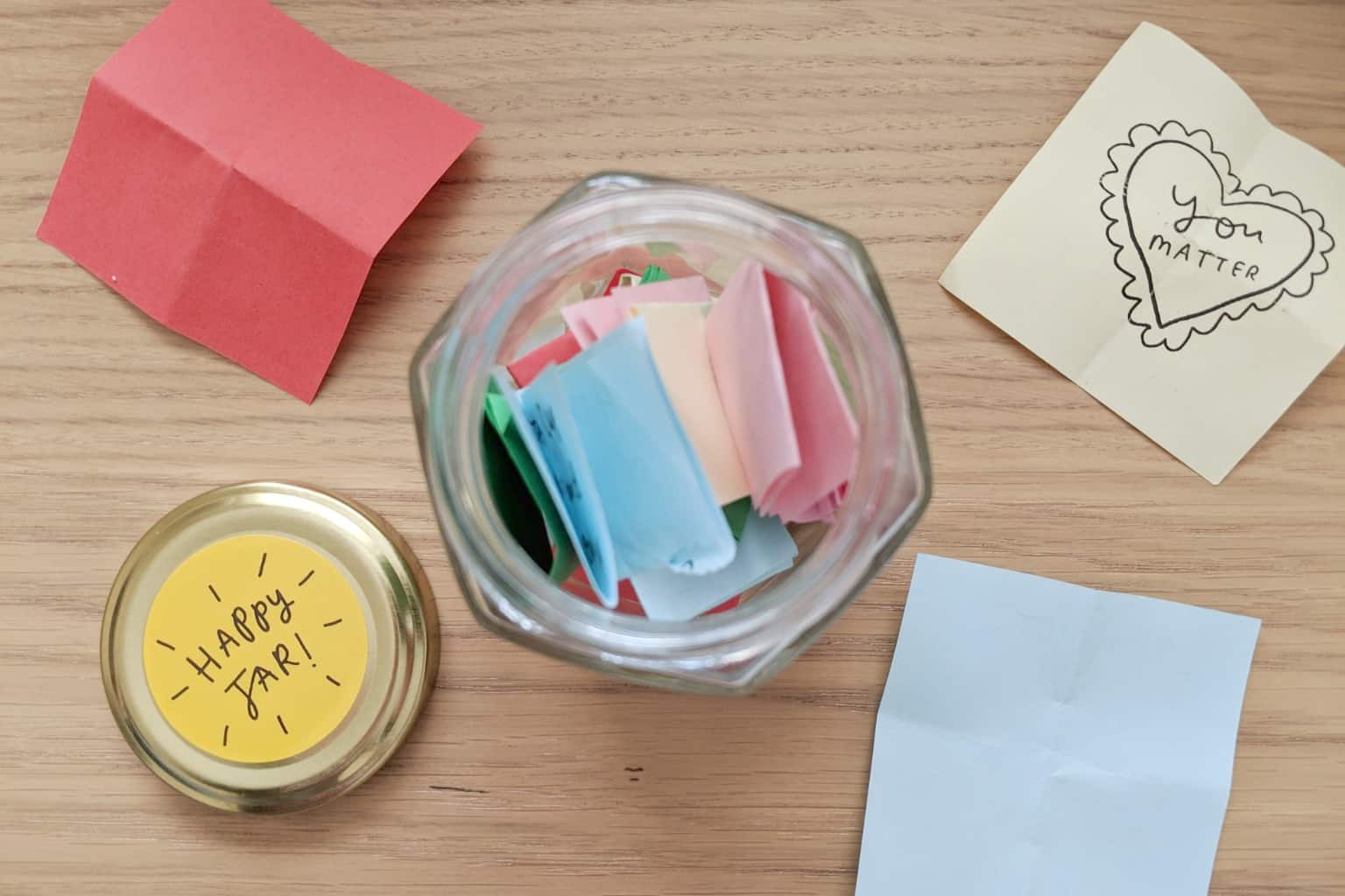 happy jar filled with notes from loved ones and affirmations