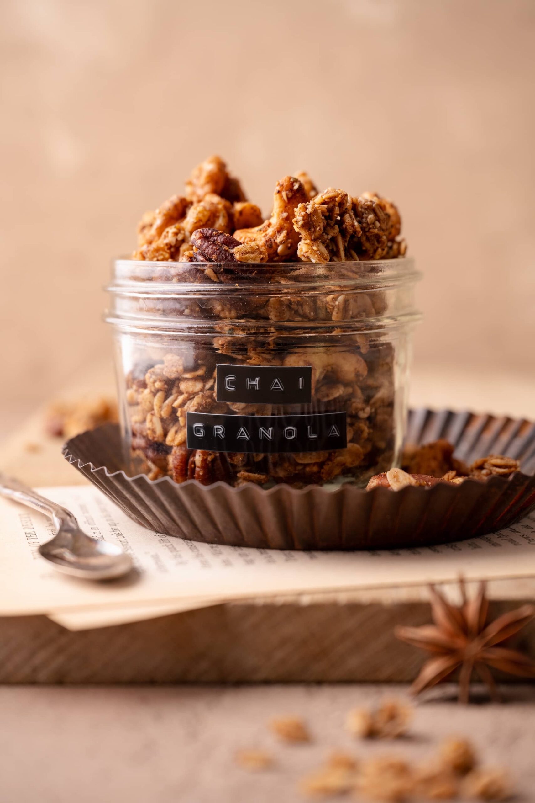 chai granola in a small glass jar, with an old school embossed label