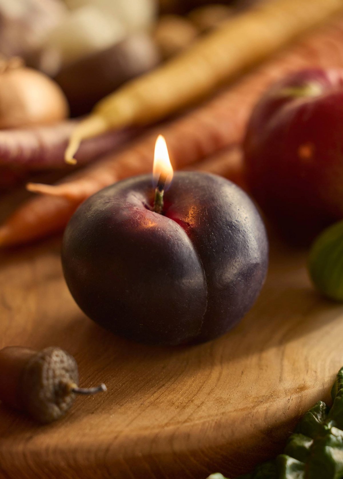 plum shaped candle that looks lifelike