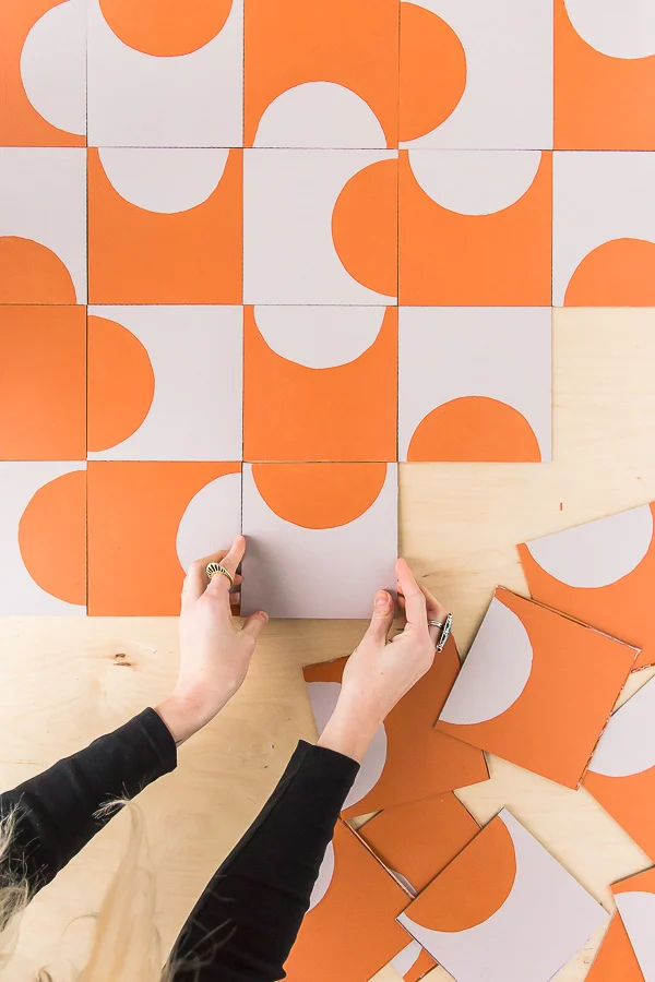 placing tile pattern on floor with abstract colorful bold pattern