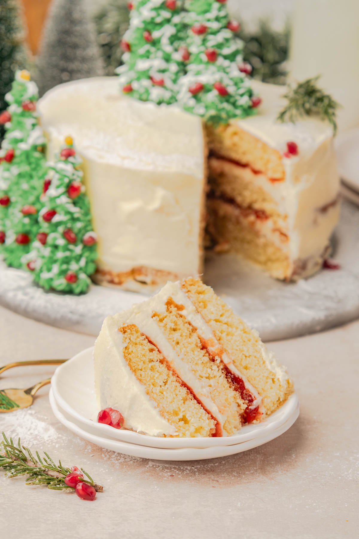 one large slice of christmas cake with 3 layers of cake and cranberry filling