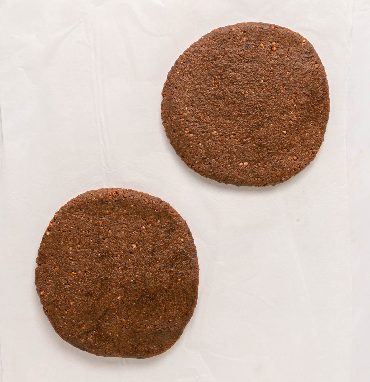two circular flat piece of chocolate hazelnut dough