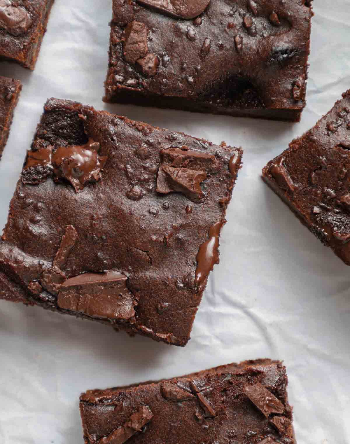 square brownies with melted chocolate and chocolate chunks on top