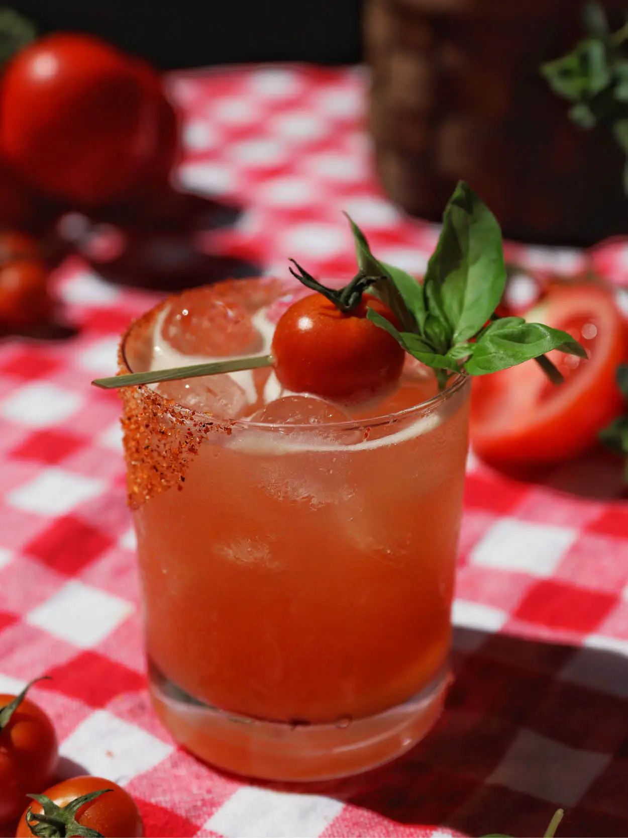 tomato margarita on a picnic table outside