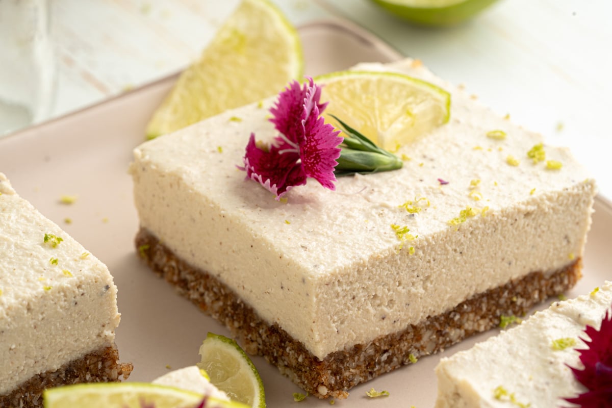 square cut up key lime bars with summer garnishes