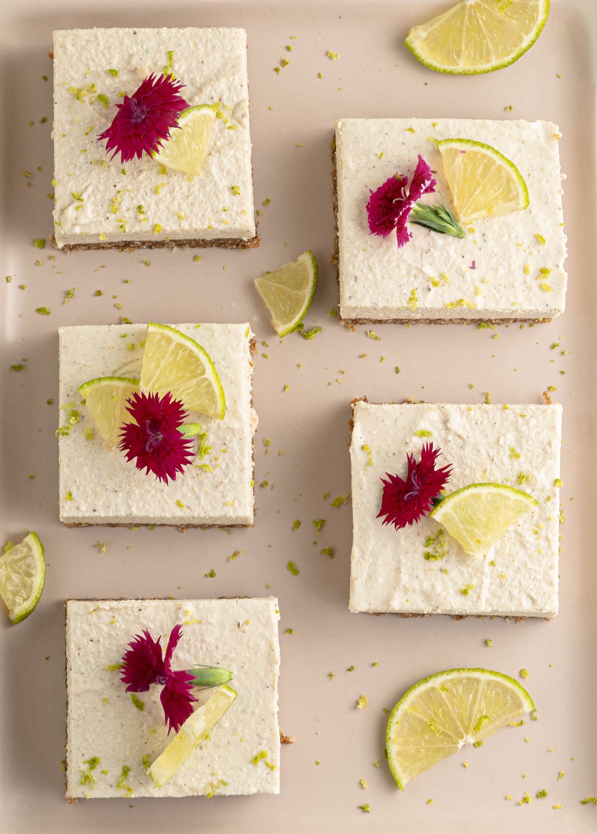 square key lime square bars on a beige tray with lime garnish